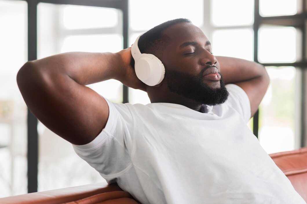 handsome-male-relaxing-while-listening-music_23-2148563544